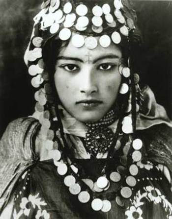 Young Berber woman of Tunisia, with tattoo and traditional jewellery (early 1900s)
