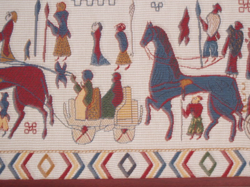 n Oseberg tapestry detail.JPG Detail from a reconstruction of the Oseberg tapestry for sale in the tourist shop in the Viking ship museum. Photo by Skadinaujo