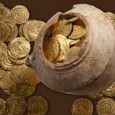 Archaeologists working in the ruins of the Crusader town of Arsuf have uncovered a cache of more than 100 gold coins, worth more than $100 000.