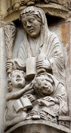 The figure of Grammatica, the first stage of medieval  education, threatens an inattentive student with her birch - south portal,  Chartres cathedral, c.1150. Photo courtesy University of Leicester