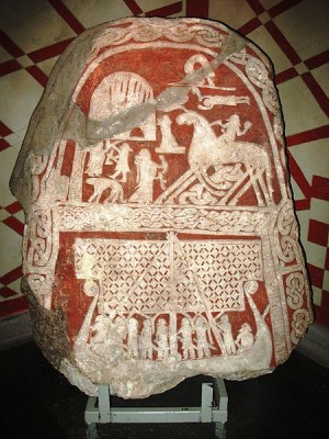 This image is usually interpreted as a Valkyrie who welcomes a dead man, or Odin himself, on the Tjängvide image stone from Gotland, in the Swedish Museum of National Antiquities in Stockholm.