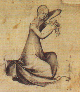 Medieval woman combing her hair