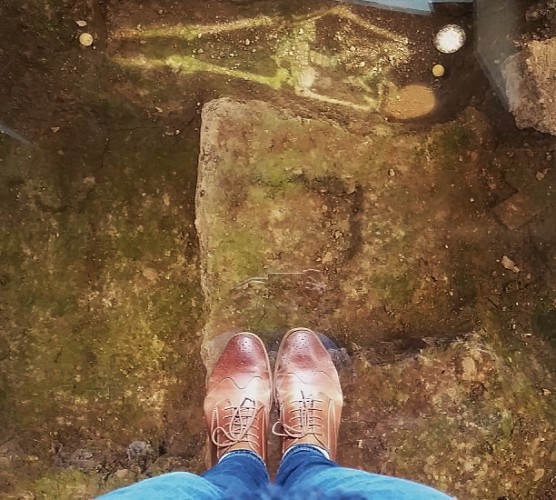 Standing over the spot Richard III was discovered at the King Richard III Visitor's Centre in Leicester. Photo by Medievalists.net