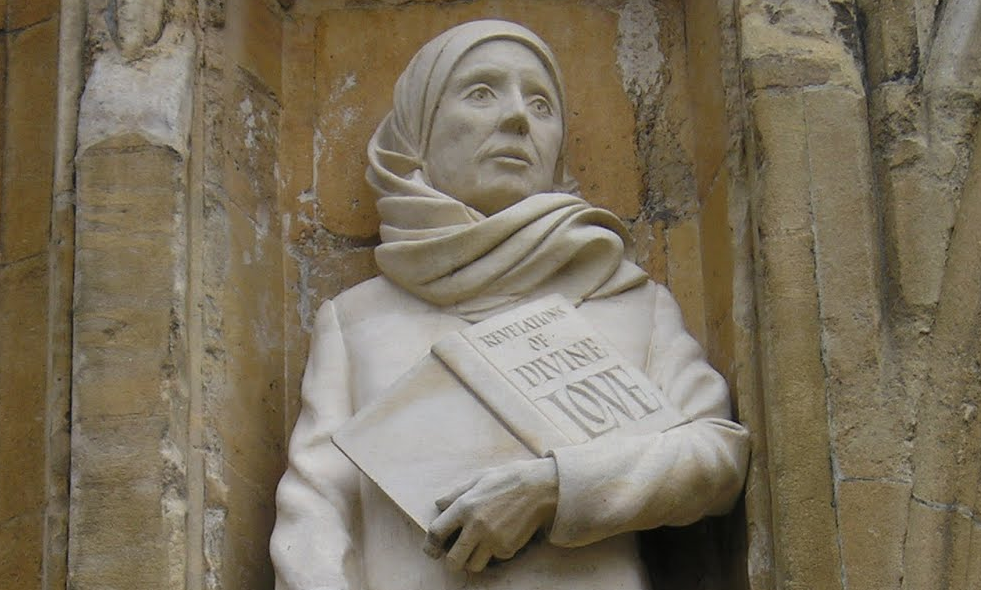 Julian of Norwich - Statue of Julian on the front of Norwich Cathedral, holding the book Revelations of Divine Love