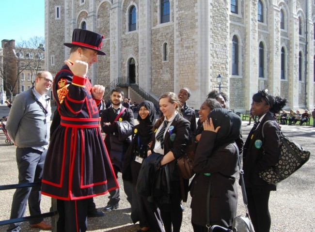 Yeoman Warder speaking to a group of school children at the Tower of London. Photo courtesy of Represent London, lotterygoodcauses.org.uk.