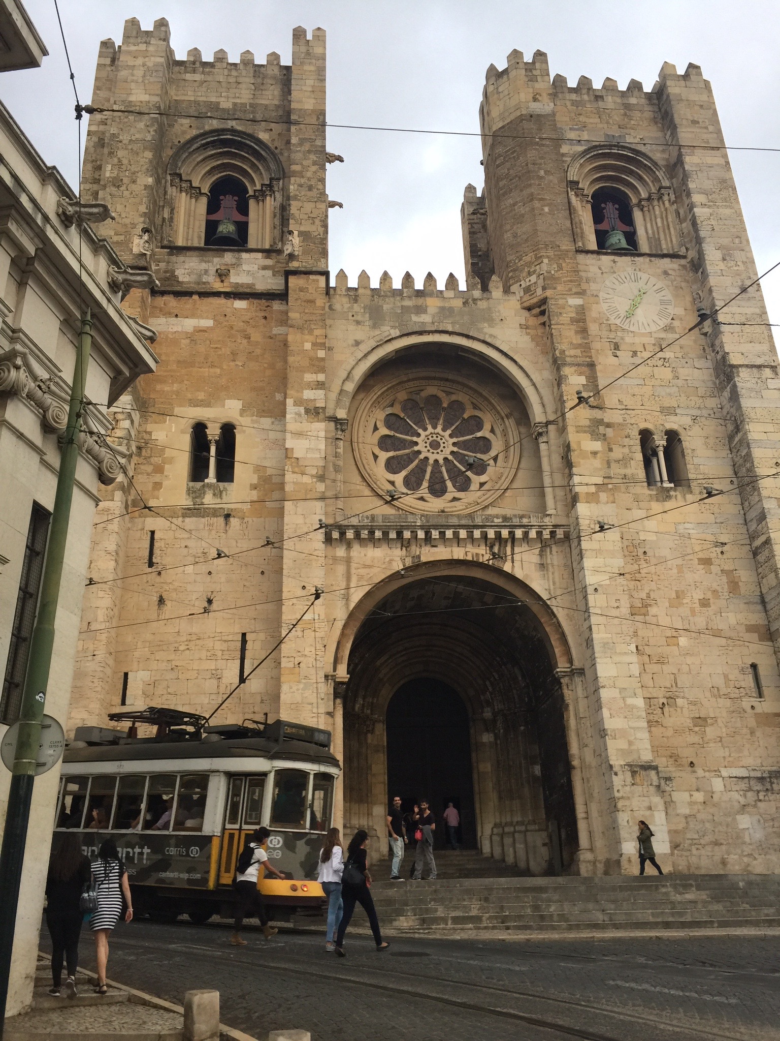 Lisbon Cathedral with the famous Tram 28 car going past. Photo by Medievalists.net