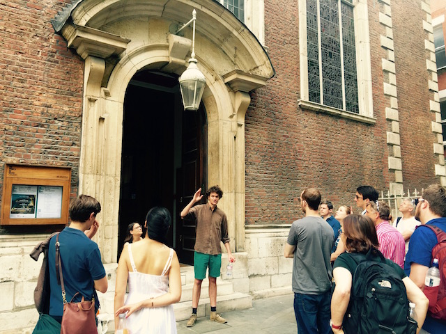 Green talking about life in medieval London in front of St. Mary-le-Bow Church, Cheapside.  