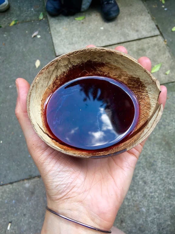 Wine, enjoyed the medieval way...out of a coconut! shell! Photo by Medievalists.net